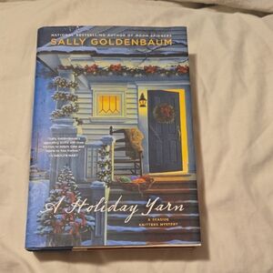 A Holiday Yarn by -Sally Goldenbaum